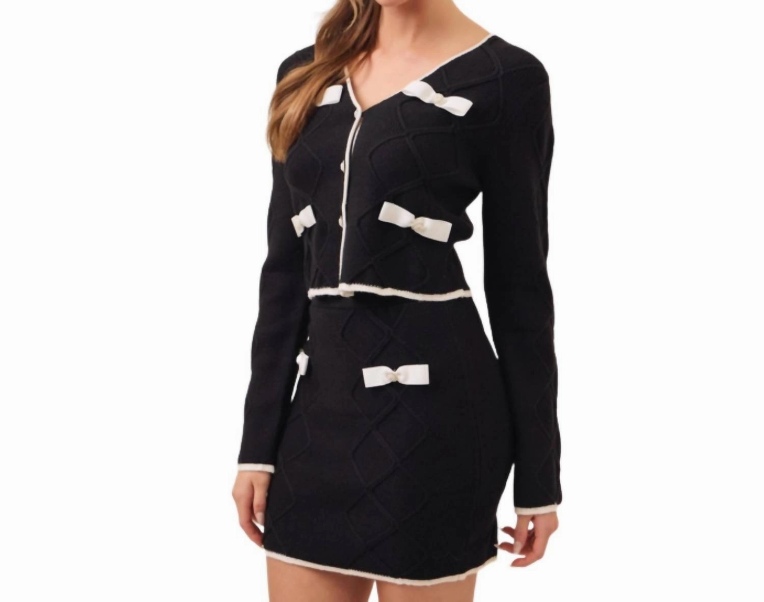 Cable Knit Mini Skirt With Contrast Bows And Pearl Flowered Buttons In Black