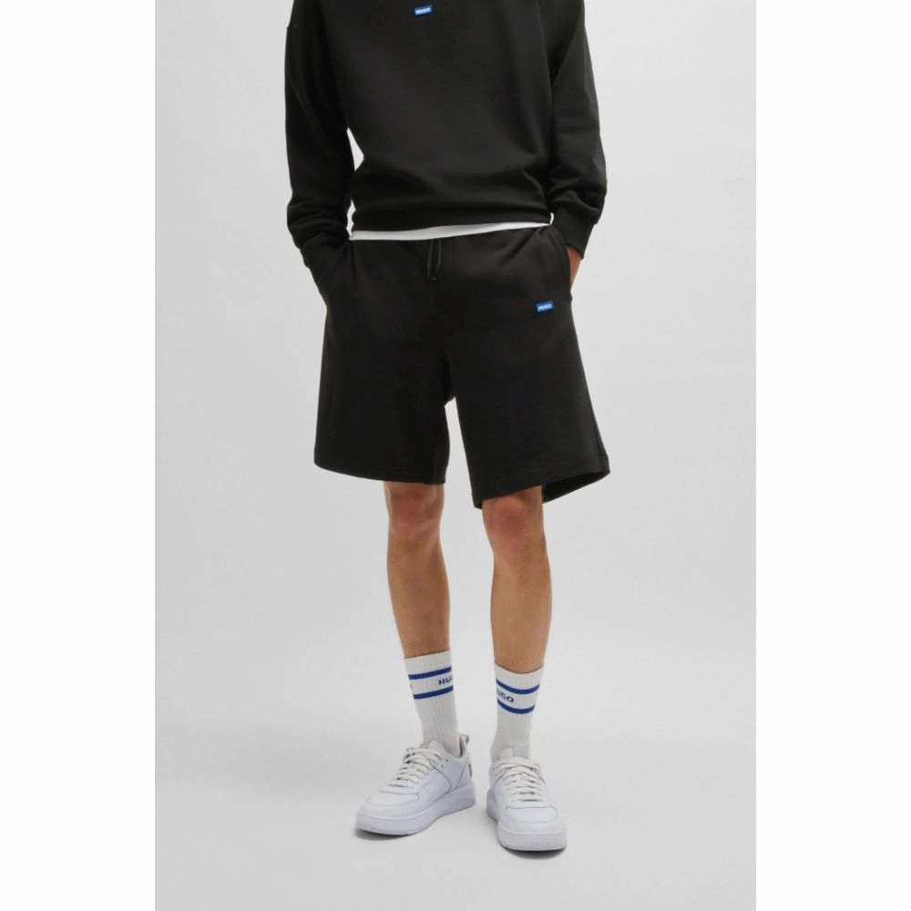 Cotton-terry shorts with blue logo patch