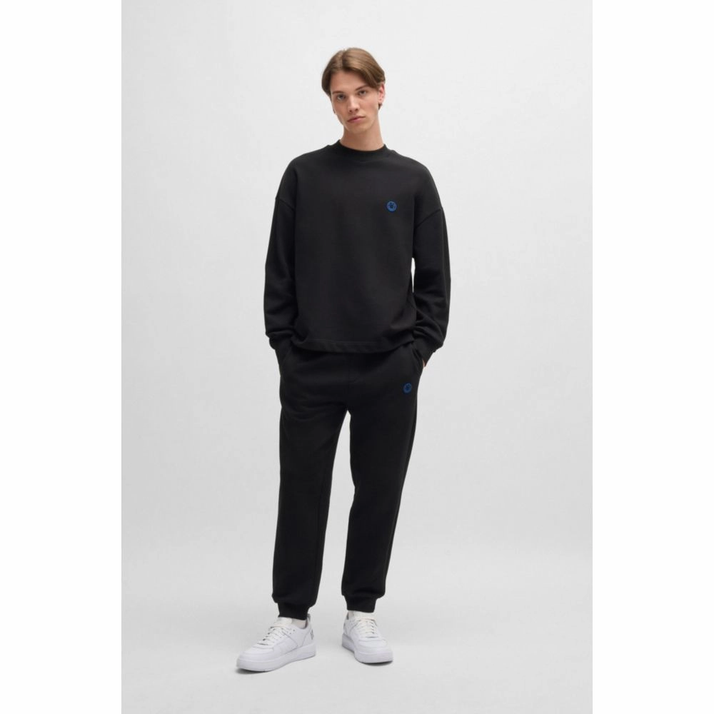 Cotton-terry tracksuit bottoms with Happy HUGO logo patch