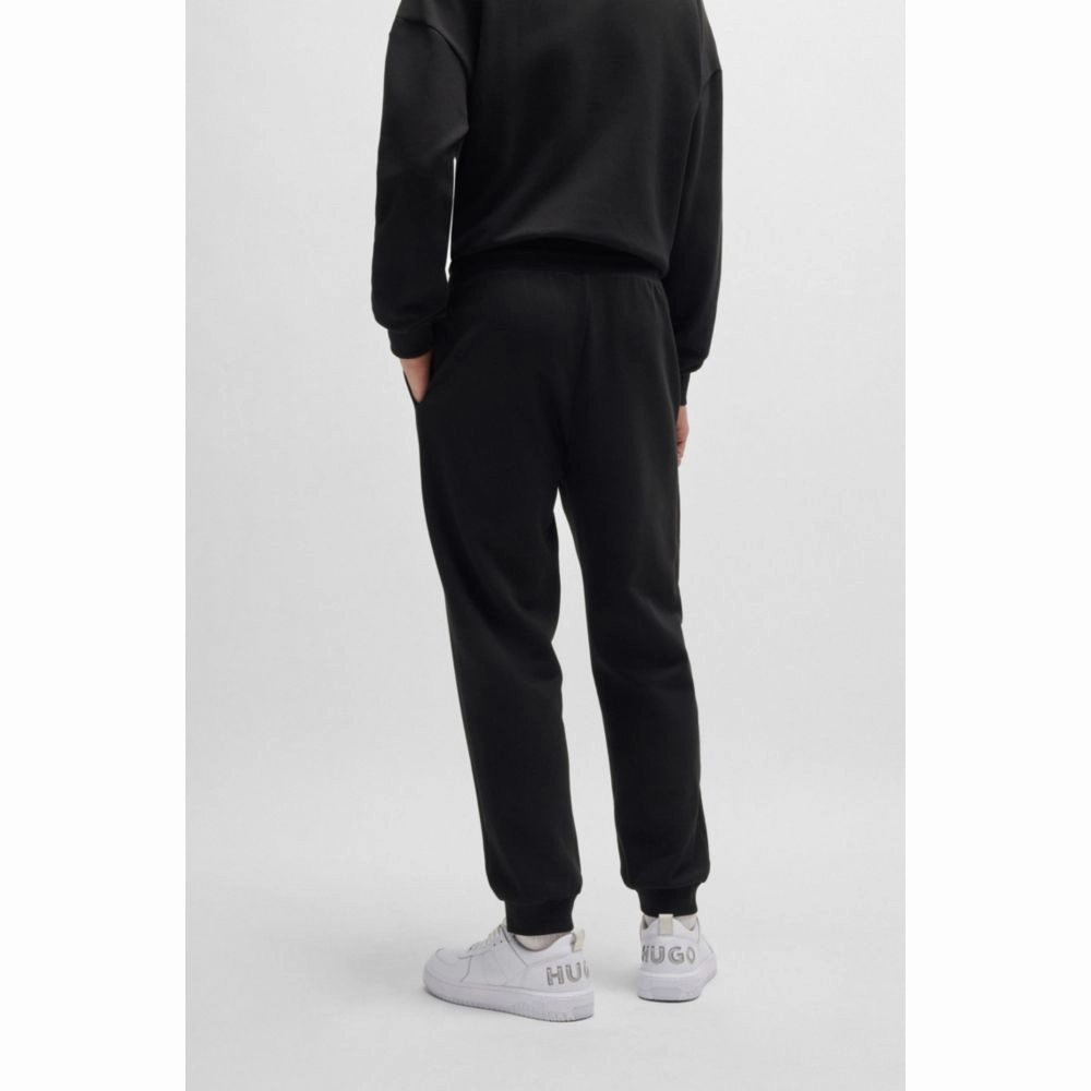 Cotton-terry tracksuit bottoms with Happy HUGO logo patch