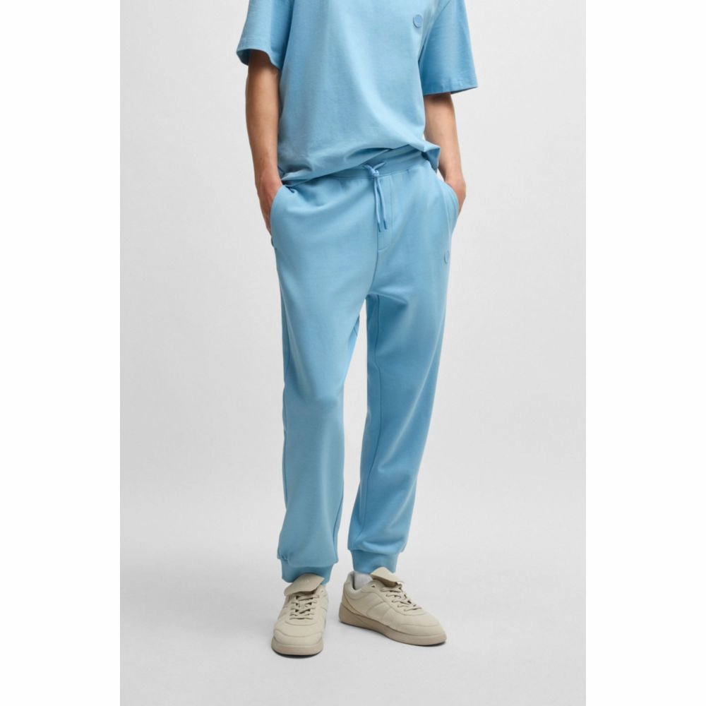 Cotton-terry tracksuit bottoms with Happy HUGO logo patch