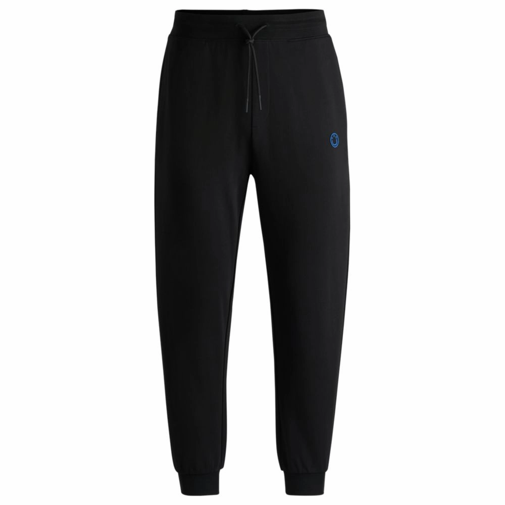 Cotton-terry tracksuit bottoms with Happy HUGO logo patch