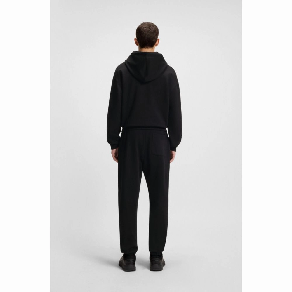 Cotton-terry tracksuit bottoms with split logo