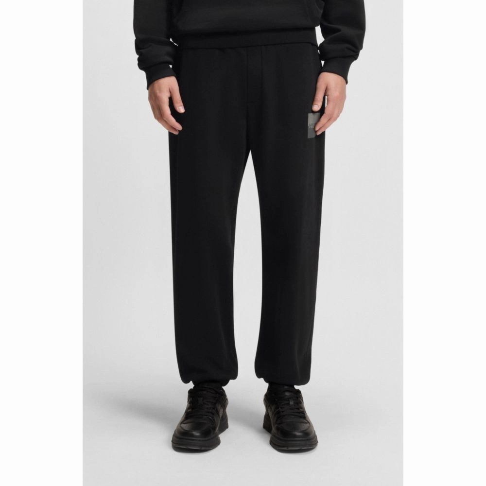 Cotton-terry tracksuit bottoms with split logo