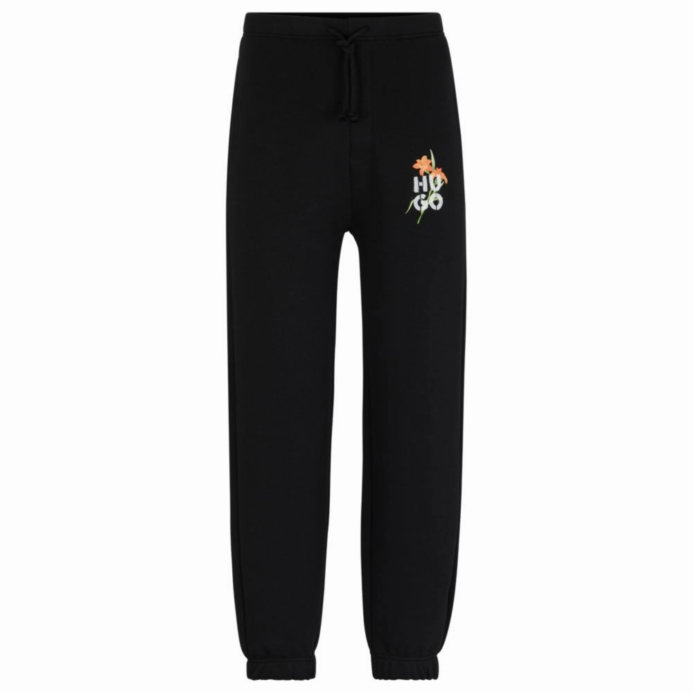Relaxed-fit tracksuit bottoms with floral logo artwork
