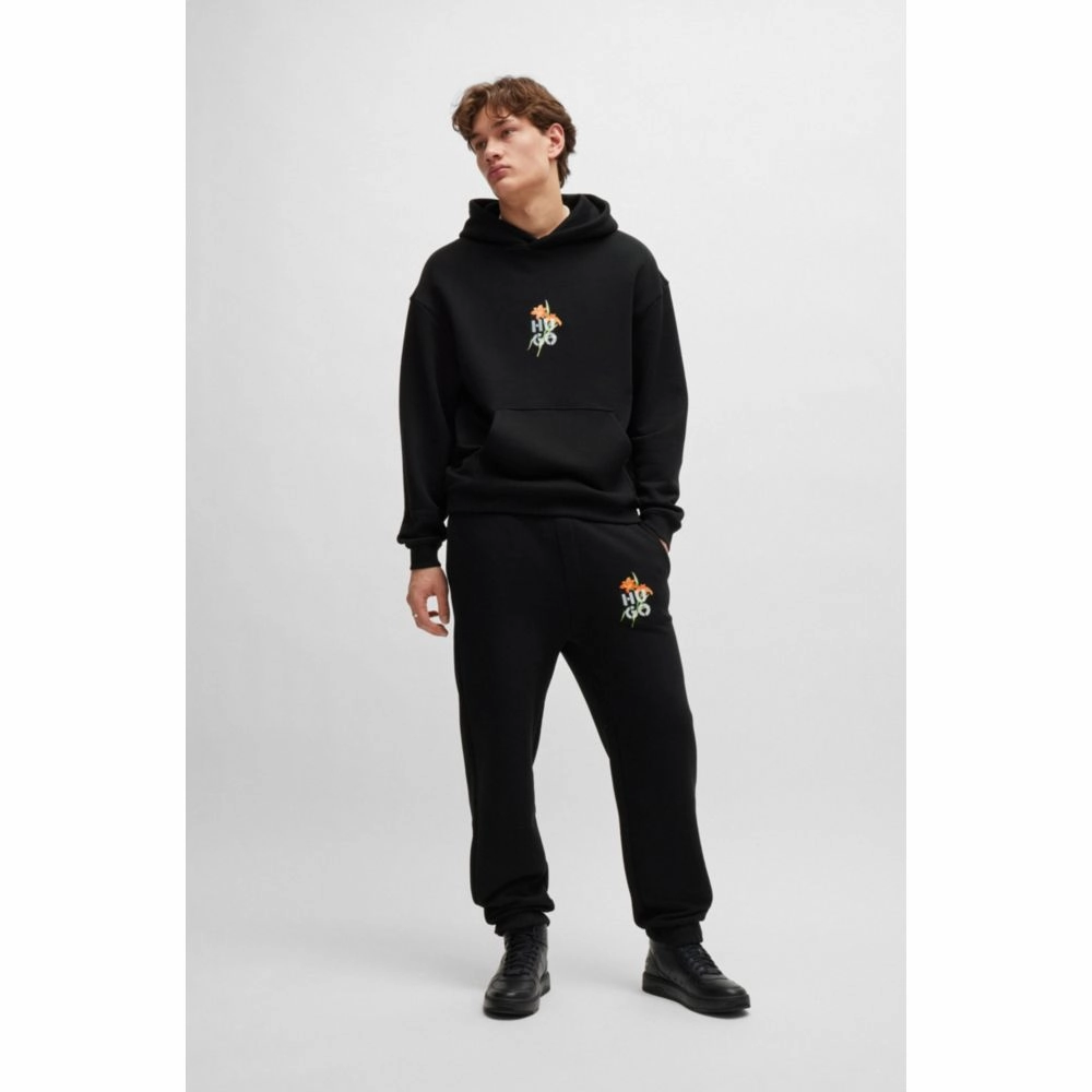 Relaxed-fit tracksuit bottoms with floral logo artwork