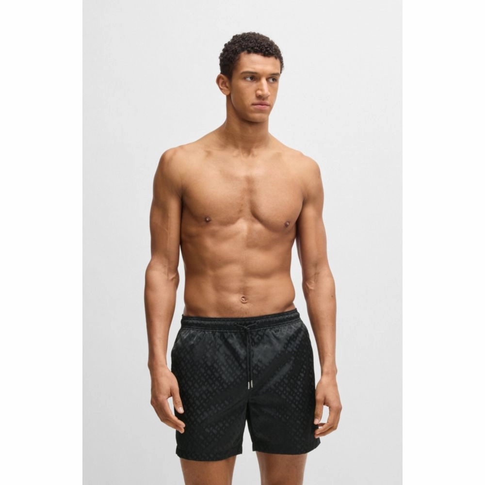 Swim shorts with all-over tonal monograms