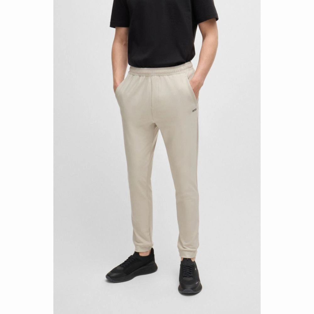 Tracksuit bottoms in stretch fabric with decorative reflective logo