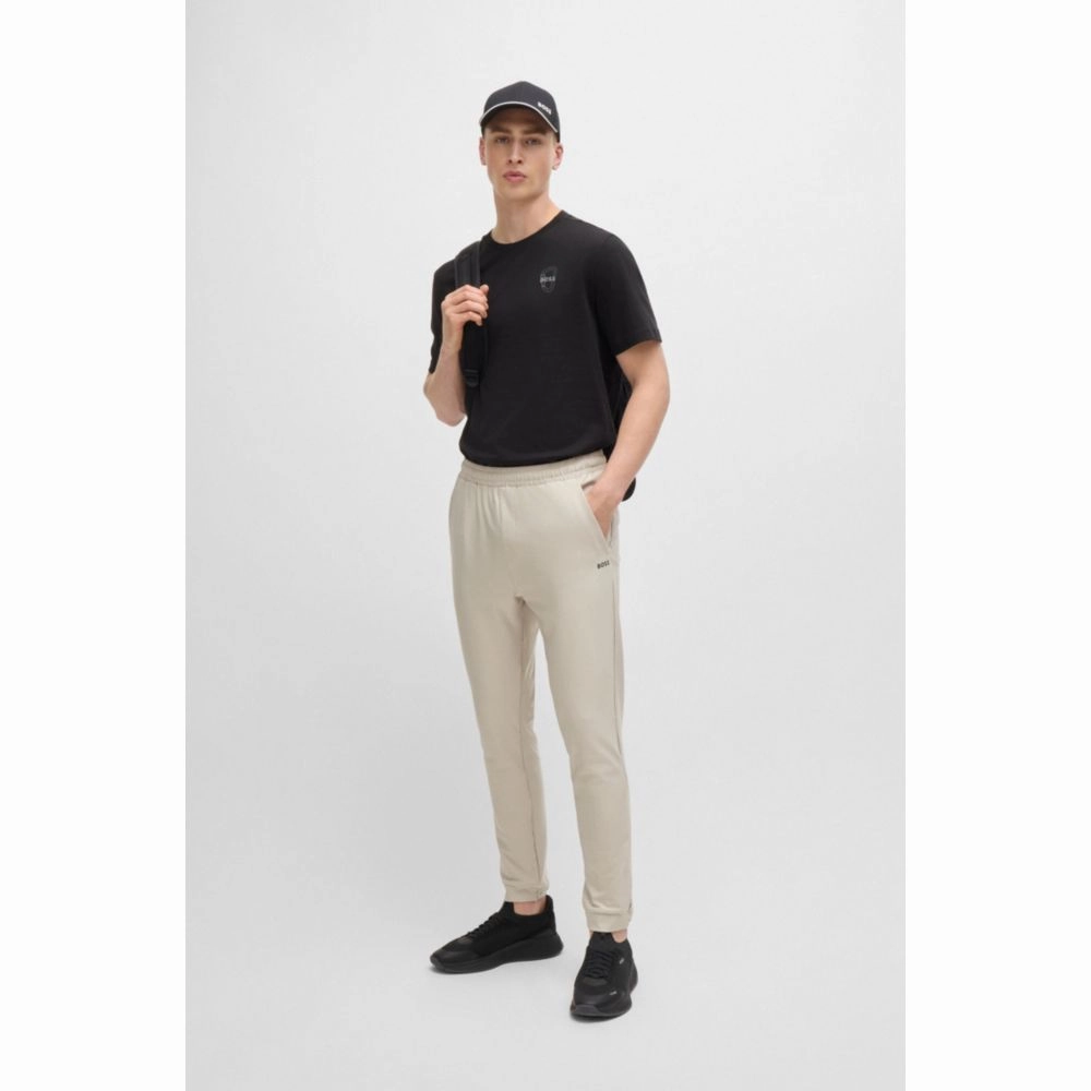 Tracksuit bottoms in stretch fabric with decorative reflective logo
